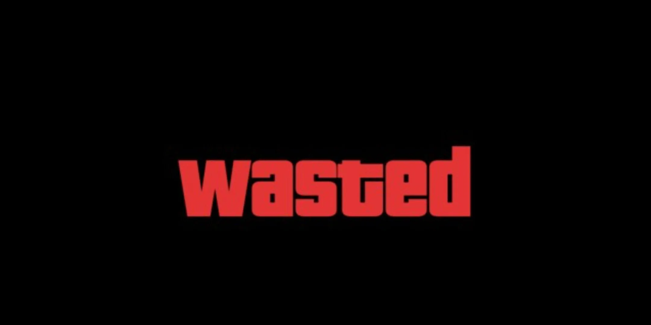 Màn hình Game Over 'WASTED' màu đỏ nổi bật trên nền đen trong Grand Theft Auto V.